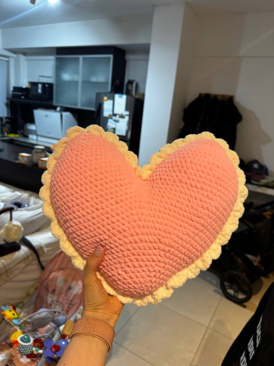 My pink crocheted heart cushion with a yellow scalloped edge